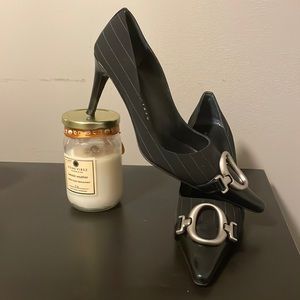 Black point tow heels with silver buckle.